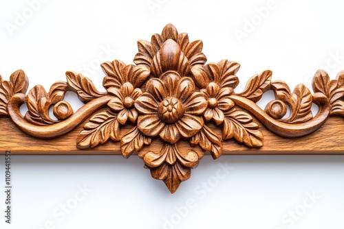 Intricate wooden carving with floral pattern on white backdrop photo