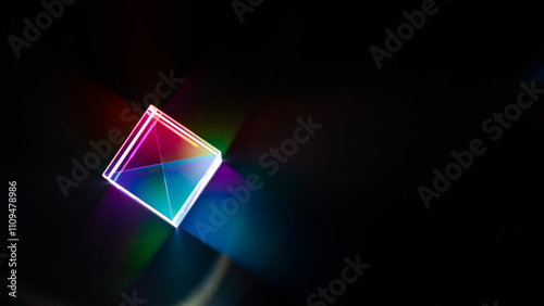 Obraz na płótnie A glass dichroic prism disperse light into different colors on a black background w salonie