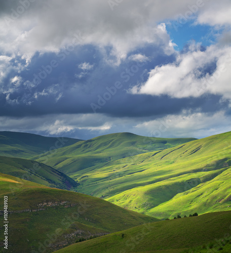 Green mountain hills during the sunset.