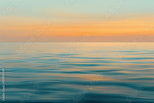 A serene ocean view at sunset, showcasing calm waters and a colorful sky.