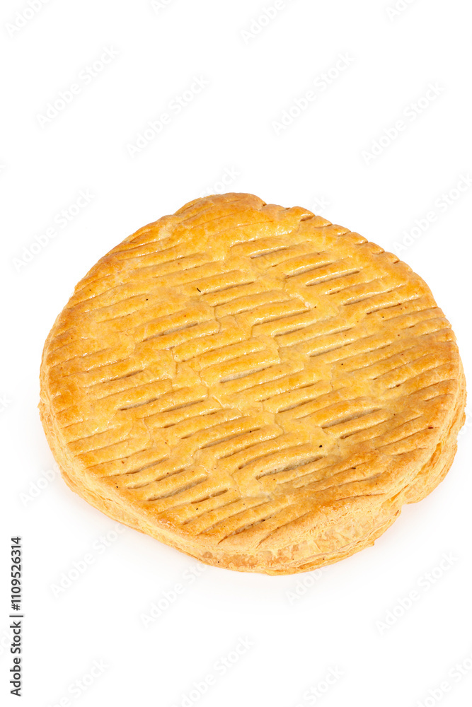 A traditional epiphany cake, French galette des rois with frangipane on a white background A traditional epiphany cake, French galette des rois with frangipane on a white background