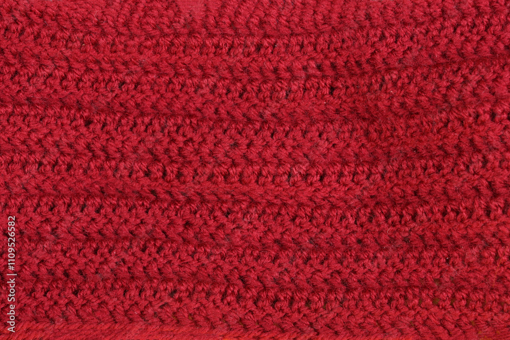 A close-up of a knitted wool texture in a rich burgundy color, perfect for a cozy and warm background A close-up of a knitted wool texture in a rich burgundy color, perfect for a cozy and warm background