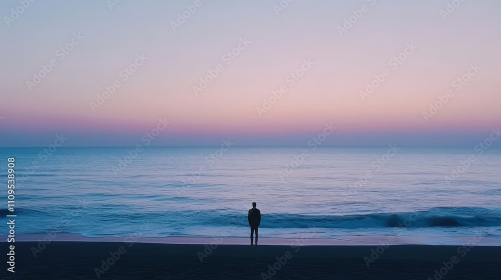 Solitary figure silhouetted against a serene, pastel sunrise over a calm ocean. Solitary figure silhouetted against a serene, pastel sunrise over a calm ocean.