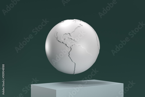 A white globe is suspended in midair on a pedestal