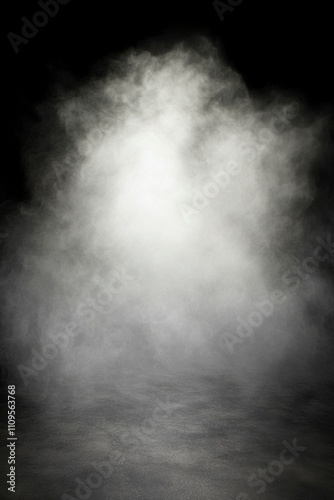 White fog or smoke illuminated against a black background.