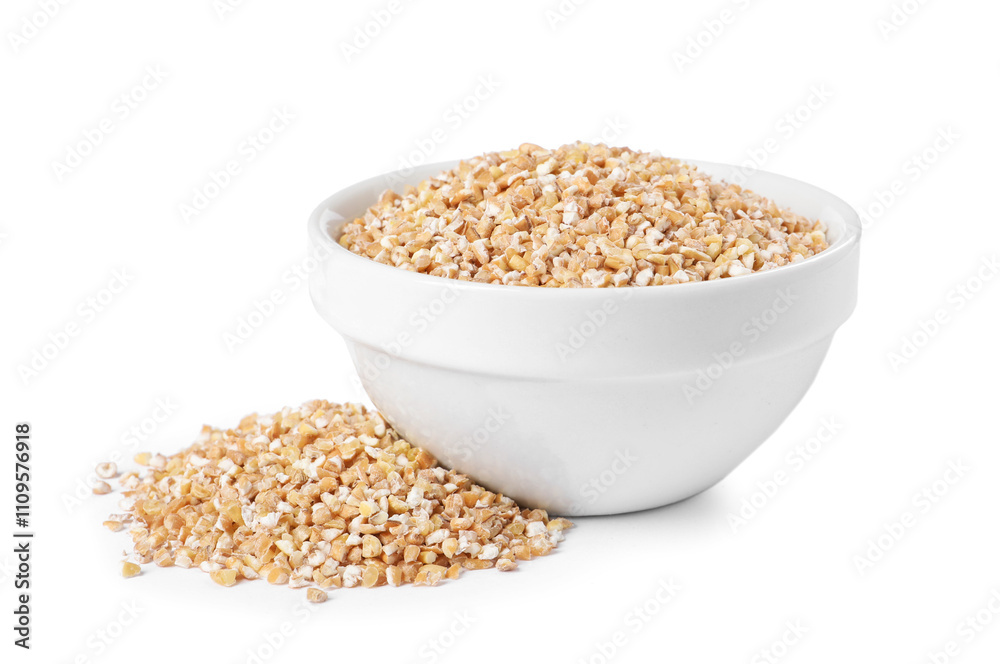 Dry wheat groats in bowl isolated on white Dry wheat groats in bowl isolated on white