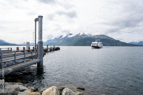 Svensby, Norway - 07.08.2024: Ferry coming in Svensby Port, Norway photo