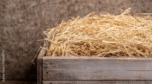 Pile of straw in a wooden crate