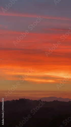 Stunning Vertical Summer Sunset with Fiery Red and Orange Clouds in the Sky