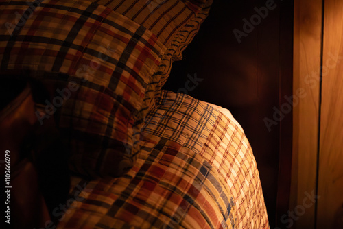 The soft glow of a lamp in a childhood bedroom while visiting home for the holidays and staying with parents.