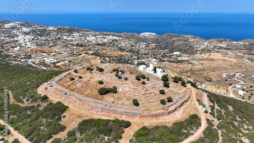 Obraz na płótnie Aerial drone photo of archaeological site of the Mycenaean Citadel and chapel of Agios Andreas built on top of hill overlooking the Aegean sea, Sifnos island, Cyclades, Greece w salonie