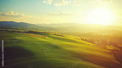 Wallpaper Mural Majestic Sunrise Over Rolling Green Hills with Soft Light Illuminating Expansive Landscape and Vibrant Nature, Evoking Tranquility and Serenity in Rural Setting Torontodigital.ca