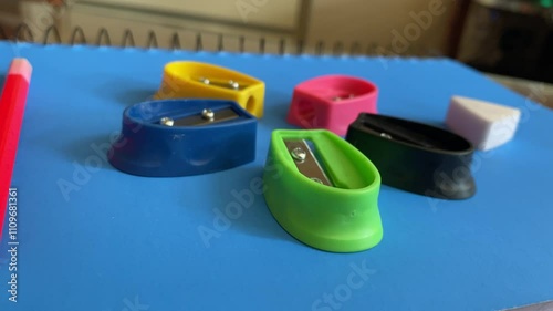 Closeup View of Pencil Sharpener and Razor on Blue