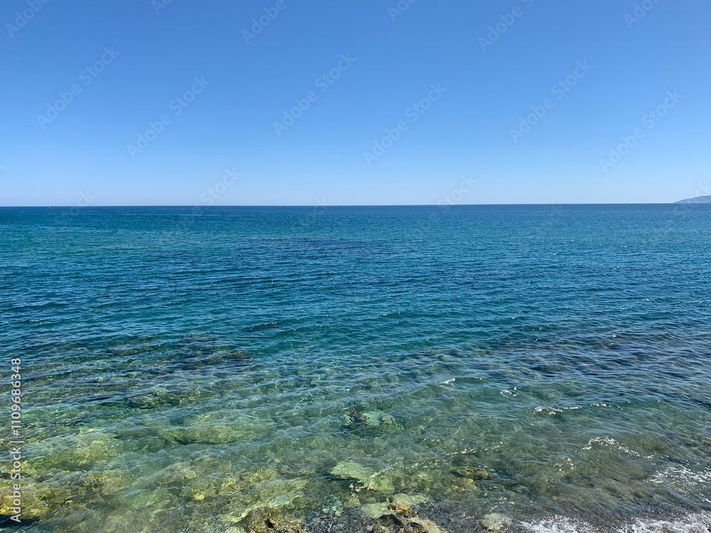 Perfectly clear water under blue sky Perfectly clear water under blue sky