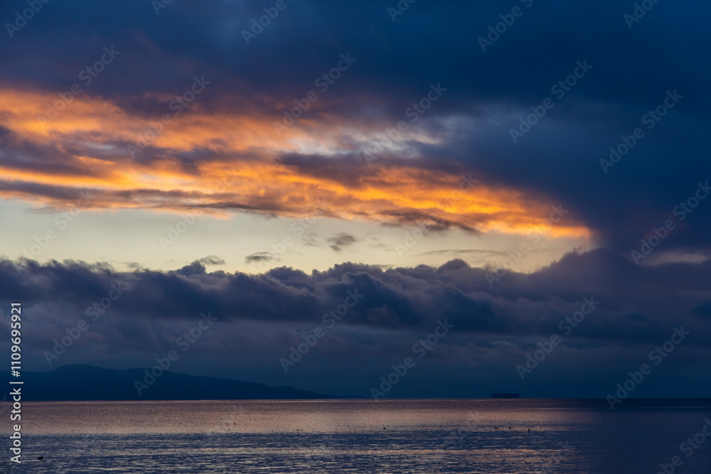 Dramatic Sunrise Over Water in Victoria, Vancouver Island, Canada Dramatic Sunrise Over Water in Victoria, Vancouver Island, Canada