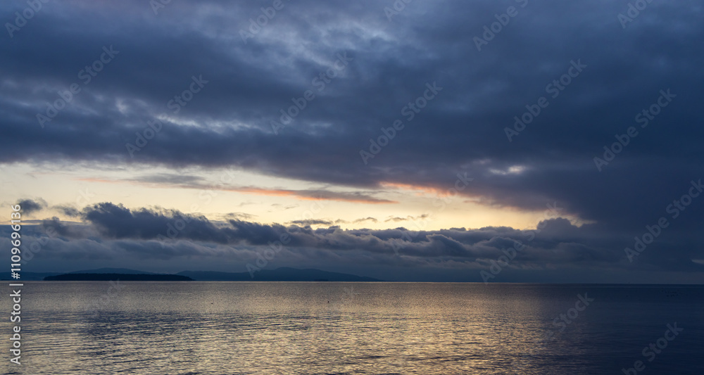 Fototapeta premium Serene Sunrise Over Victoria's Coastline on Vancouver Island, BC, Canada