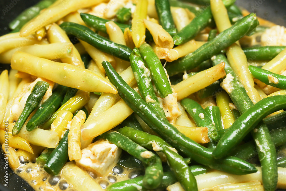Fried yellow and green beans with olive oil and feta cheese. Shiny vegetables with rich flavor. Healthy and affordable dish idea. Perfect for a nutritious and delicious meal. Food lover paradise. Fried yellow and green beans with olive oil and feta cheese. Shiny vegetables with rich flavor. Healthy and affordable dish idea. Perfect for a nutritious and delicious meal. Food lover paradise.