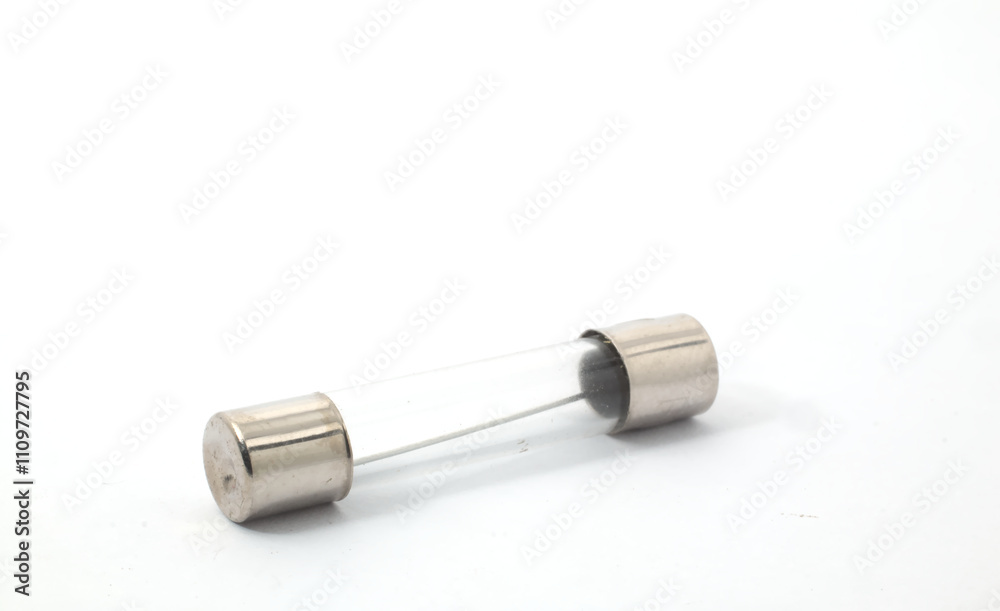 Naklejka premium A tube fuse on a white background. A safety component in a vehicle's electrical system that is shaped like a clear tube and wraps around its safety wire. 