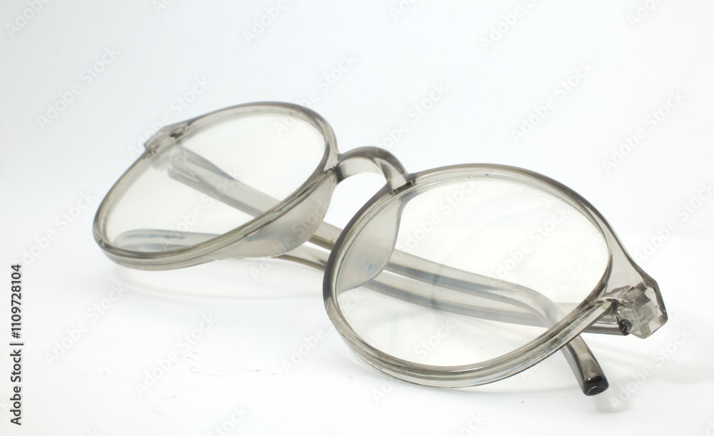 A pair of glasses with a transparent frame on a white background. Used for fashion, reading, or vision. A pair of glasses with a transparent frame on a white background. Used for fashion, reading, or vision.