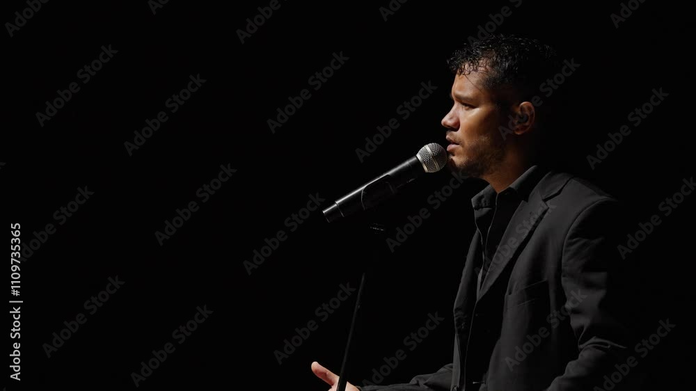 Video of singer-songwriter making hand gestures Video of singer-songwriter making hand gestures