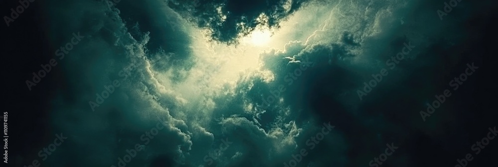 Moody Clouds Over a Dramatic Dark Sky. Stormy Cloudscape for Banner Design with Expansive Copy Space Moody Clouds Over a Dramatic Dark Sky. Stormy Cloudscape for Banner Design with Expansive Copy Space