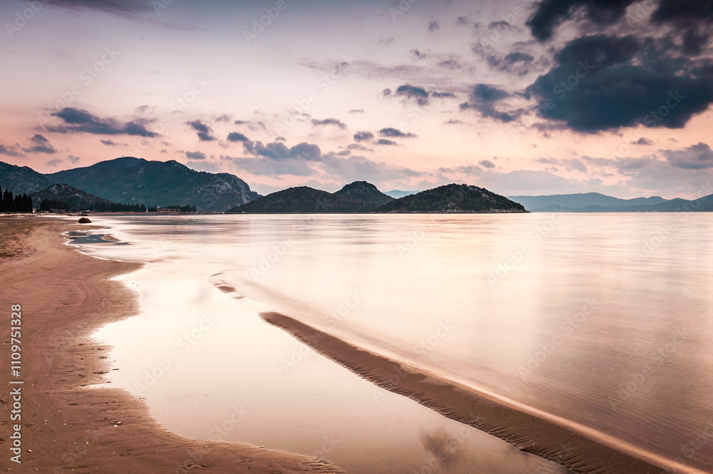Fototapeta premium Tranquil Sandy Beach at the Estuary of River Neretva in Southern Croatia, Overlooking the Adriatic Sea and Surrounding Coastal Landscape