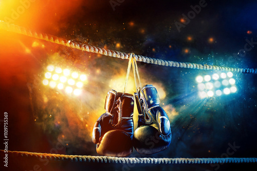 Boxing gloves on the ring ropes. Photo for a bookmaker website or application in high quality. photo