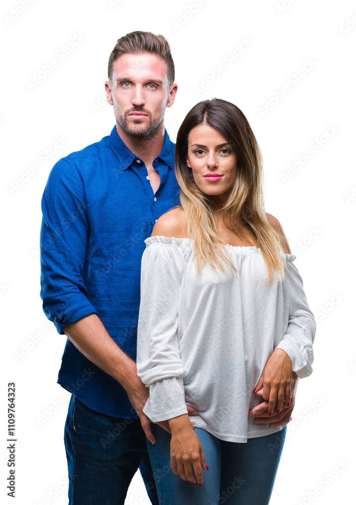 Young couple in love over isolated background with serious expression on face. Simple and natural looking at the camera. Young couple in love over isolated background with serious expression on face. Simple and natural looking at the camera.
