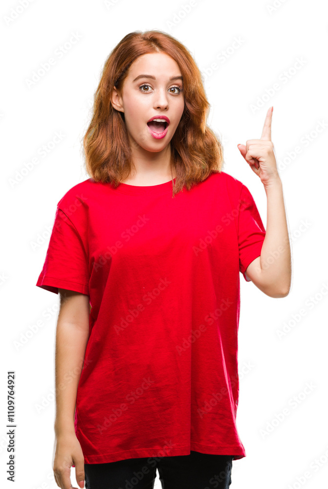 Young beautiful woman over isolated background pointing finger up with successful idea. Exited and happy. Number one. Young beautiful woman over isolated background pointing finger up with successful idea. Exited and happy. Number one.