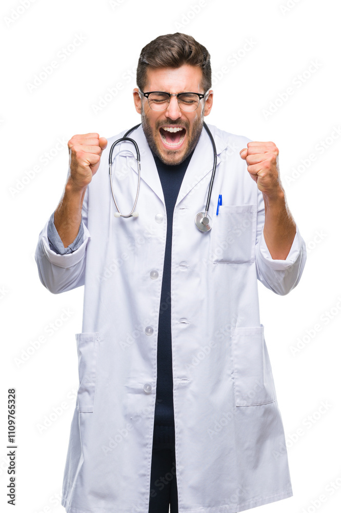 Young handsome doctor man over isolated background excited for success with arms raised celebrating victory smiling. Winner concept. Young handsome doctor man over isolated background excited for success with arms raised celebrating victory smiling. Winner concept.