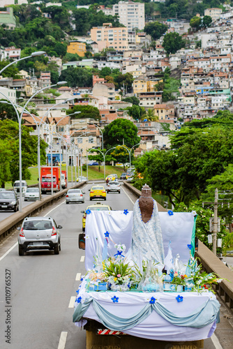 Giant image of Iemanjá being taken in an open car through the city to Copacabana beach. Celebration for Iemanjá day in Rio de Janeiro, Brazil.