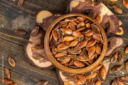 , overcooked or burnt pumpkin seeds on the table photo