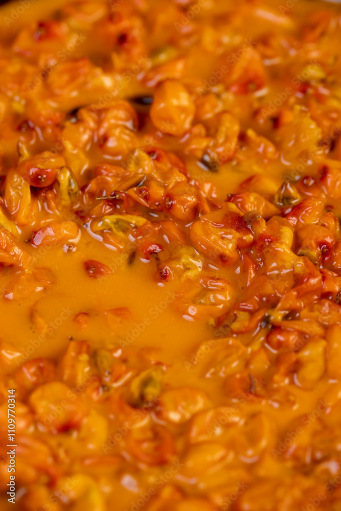 crushed sea buckthorn berries in a wooden bowl crushed sea buckthorn berries in a wooden bowl