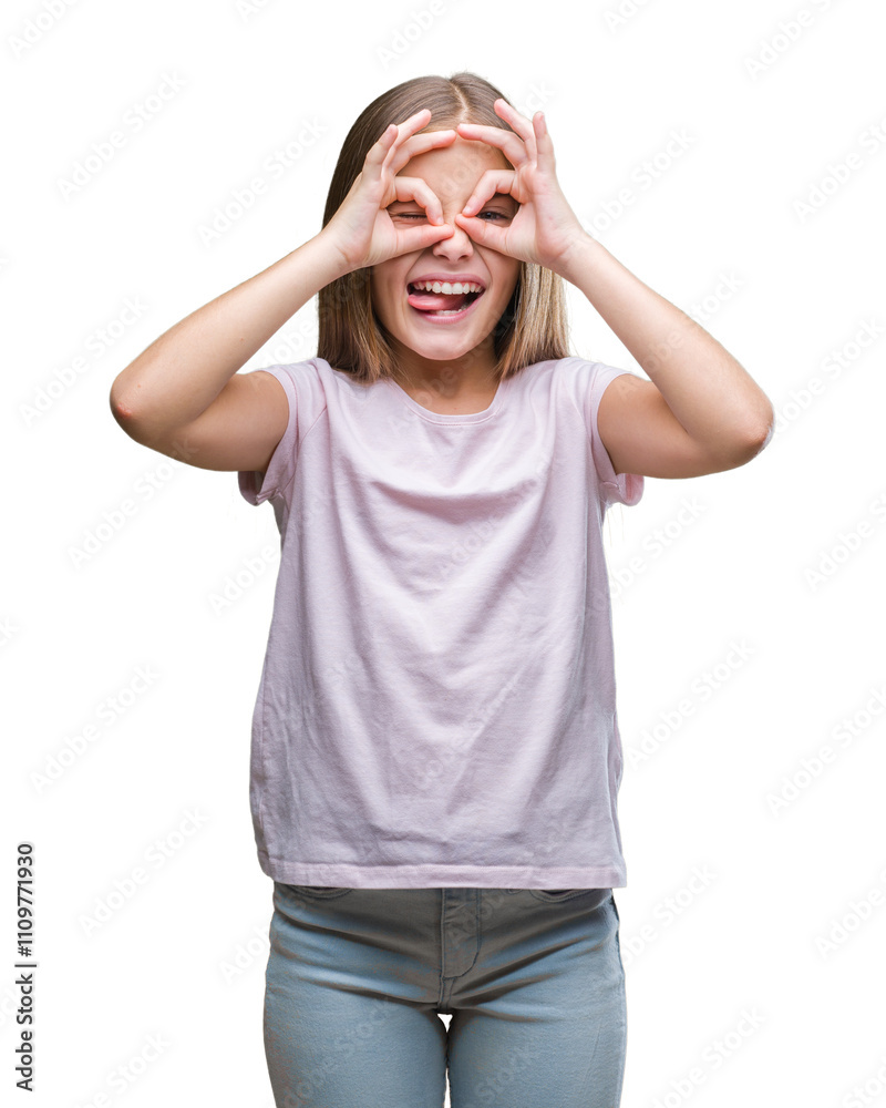 Young beautiful girl over isolated background doing ok gesture like binoculars sticking tongue out, eyes looking through fingers. Crazy expression. Young beautiful girl over isolated background doing ok gesture like binoculars sticking tongue out, eyes looking through fingers. Crazy expression.