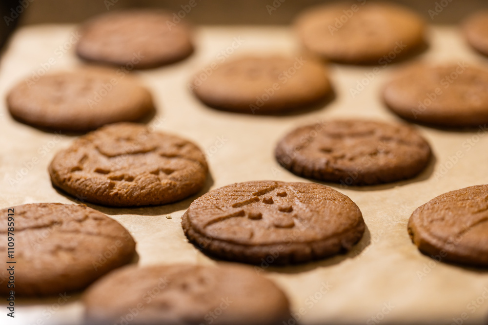 Oven tray with fresh hot gingerbread cookies, traditional Christmas recipe. aroma and taste of new year holidays Oven tray with fresh hot gingerbread cookies, traditional Christmas recipe. aroma and taste of new year holidays
