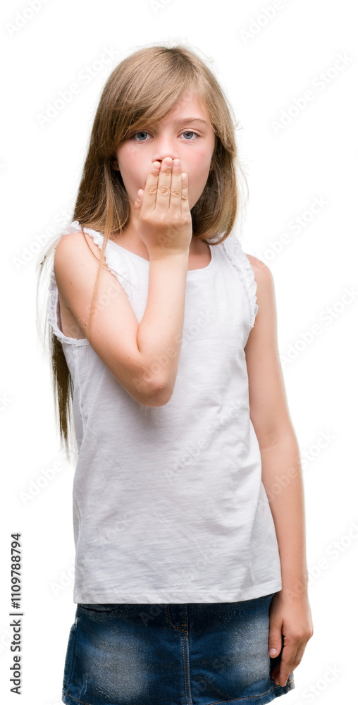 Young blonde toddler cover mouth with hand shocked with shame for mistake, expression of fear, scared in silence, secret concept Young blonde toddler cover mouth with hand shocked with shame for mistake, expression of fear, scared in silence, secret concept