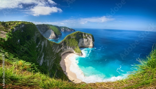 landscape of sunny day with turquoise ocean blue sky and mountains kelingking beach is an incredible little cove on nusa penida bali island indonesia mountain scenery wallpaper background photo