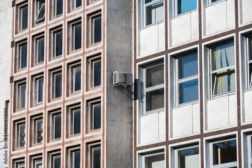 Fototapeta premium Close-up of windows on a sunlit building