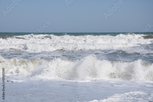 View of the sea waves with white foam.
