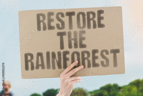 Wallpaper Mural The phrase 'Restore the rainforest' on a banner held by a person, revive and protect the rainforest ecosystem. Eco. Ecology. Sustainability. Forests. Nature. Green. Conservation Torontodigital.ca
