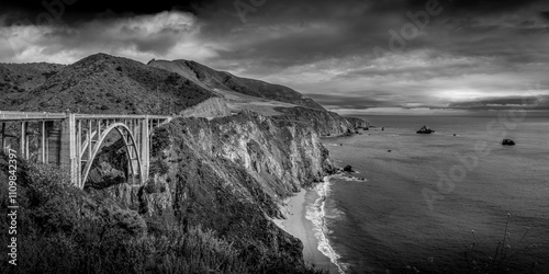 Black and White image of the Bixby Bridge in the heart of California's Big Sur. The bridge, completed in 1932, spans the Bixby Creek, providing a crucial link along the iconic Highway 1