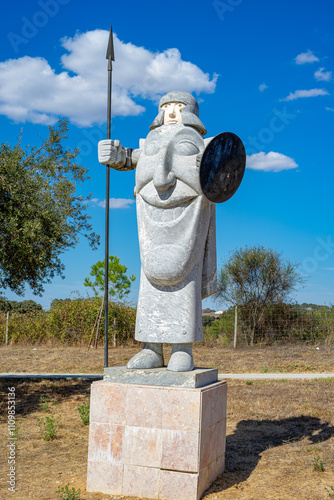 Stone statue by artist Jorge Pe Curto. Stone statue by artist Jorge Pe Curto located at a gas station in Alentejo-Portugal. photo