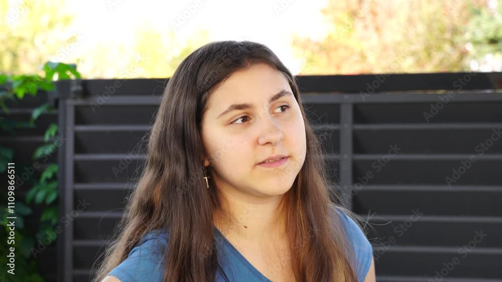 Emotional teenage girl walks outdoors Emotional teenage girl walks outdoors