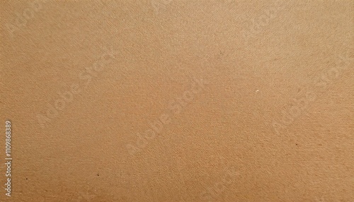 自然素材の温もりが感じられるリサイクル段ボールテクスチャ背景、優しいベージュとブラウンのトーンで広がる無地スペース
