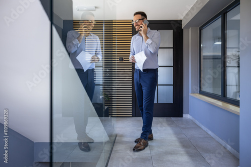 Businessman on Phone Call in Modern Office Corridor