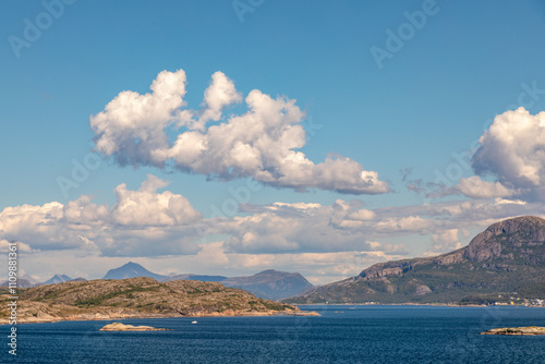 A Perfect Midsummer Day Along the Coast of Northern Norway Near Lauvøya Island, Blue Sky, Puffy Clouds, Midnight Sun