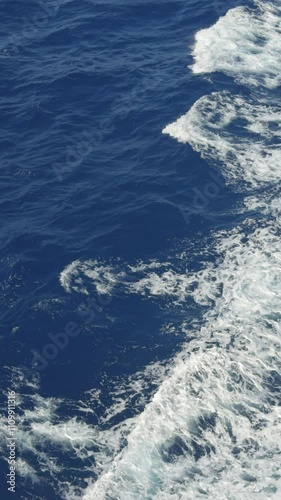 Wallpaper Mural 4K ship wake ocean portrait vertical realtime blue water surface. For social media feeds stories mobile content creation. Smartphone viewing format Torontodigital.ca