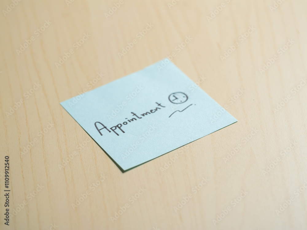 Close-up of a minimalist sticky note reminder on office desk for productivity Close-up of a minimalist sticky note reminder on office desk for productivity