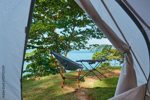 incredible view from the tourist tent on the seashore, opening the tent door, folding chair and table