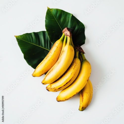 A bunch of ripe bananas with leaves, isolated white background, minimalism art style photo